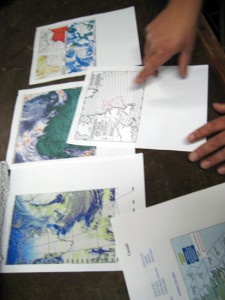 Mark Maloof delivers a weather report. In the forecast: a low pressure system, storm, 40 knot winds. The conditions are not favorable, but they may get worse. Captain Sheasley, Will Ostrom, and Amy Bower decide not to wait. The mooring deployment will begin as soon as the Knorr reaches the site, at around 9 p.m. tonight. (Photo by Donovan Hohn, Woods Hole Oceanographic Institution)