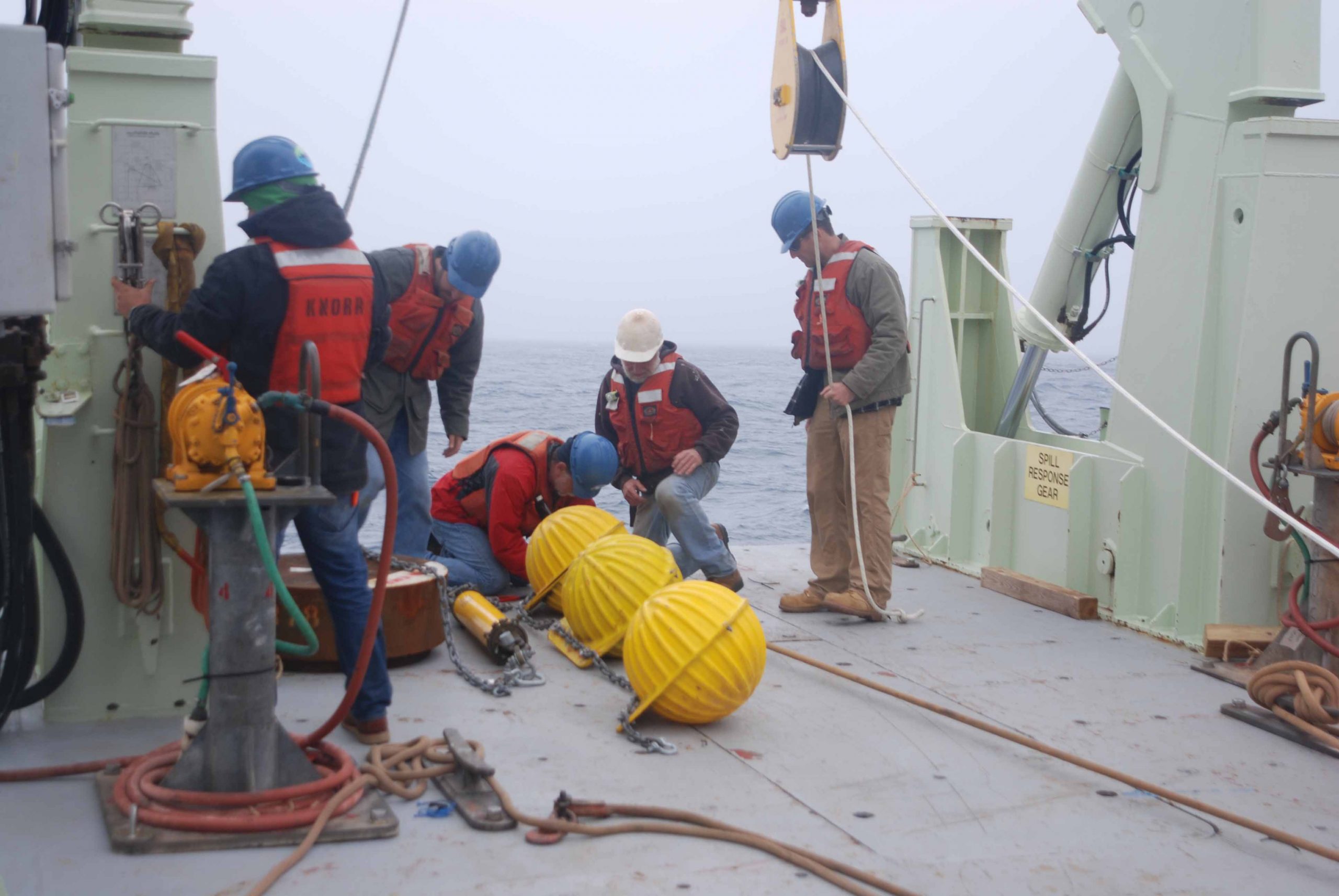 Bottom flotation, release, and anchor for the first sound source mooring.