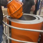 Photo of someone putting a RAFOS float into the Pressure Tank.